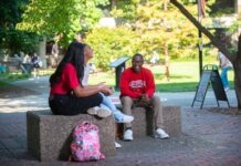 Students talking together on campus.