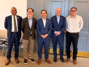 Aruni Bhatnagar, Brian Stone, Mayor Craig Greenberg, Ted Smith and Patrick Piuma at Stone's presentation in June 2026. 