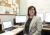 Postdocs find purpose and opportunity at UofL Smiling woman seated at desk surrounded by four computers