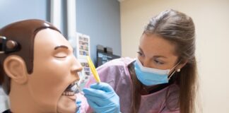Dental student Katie Hayden works with a dental manikin.